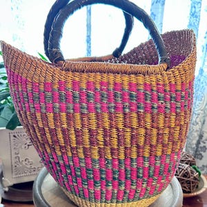 Handwoven Vintage Bolga Basket with Leather-Wrapped Handle: Colorful Market Tote from Ghana - Cultural, Durable, and Versatile